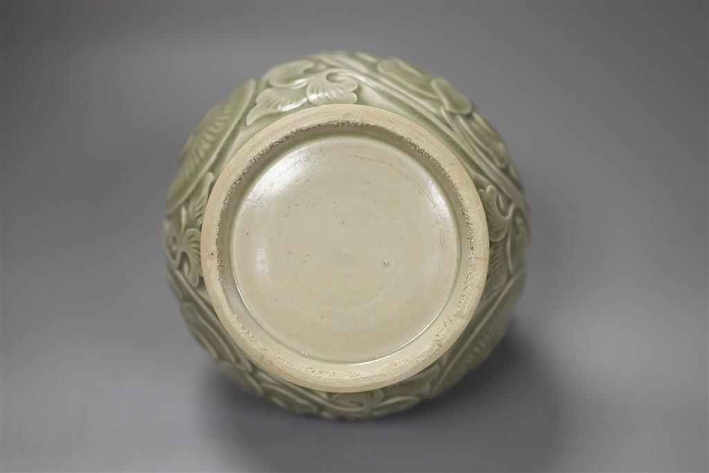 A Chinese carved celadon ewer, 16cm high